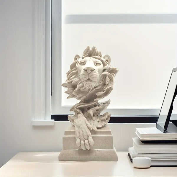 Decorative lion statue on a table with a laptop and books in the background  decor aura works