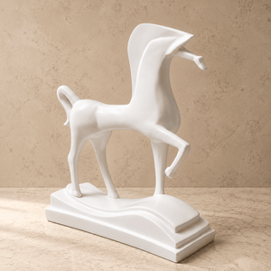 A modern white ceramic horse figurine standing on a matching wave-shaped base, set against a textured beige background.
