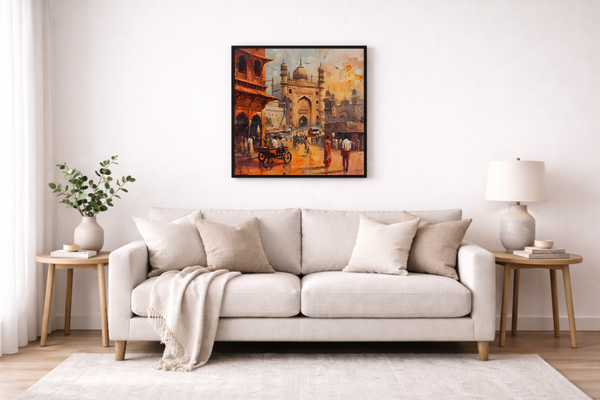 Living room with a beige sofa, decorative pillows, and a framed painting on the wall.
