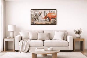 A framed art print depicting prehistoric rhinoceros dinosaurs hangs on a white wall above a modern beige sofa in a bright, minimalist living room.