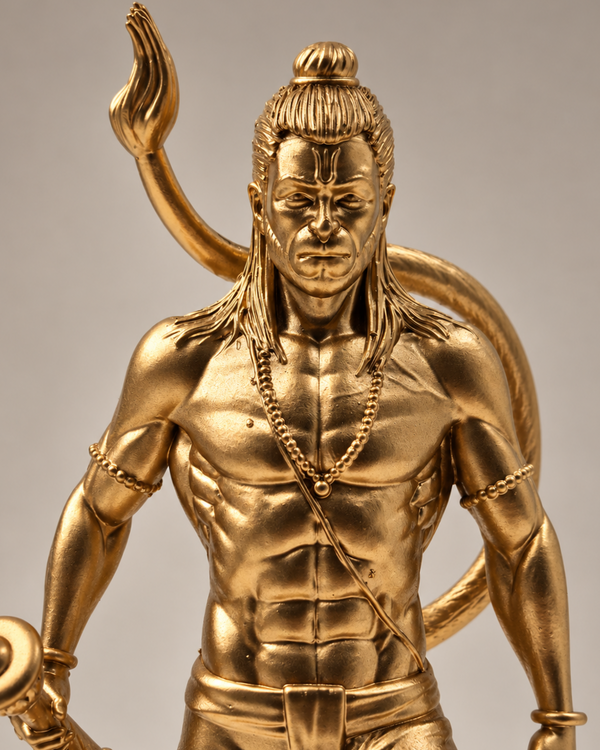 A metallic gold statue of a muscular male figure with a raised arm and a curved tail-like form behind him, shown against a plain light gray studio background.